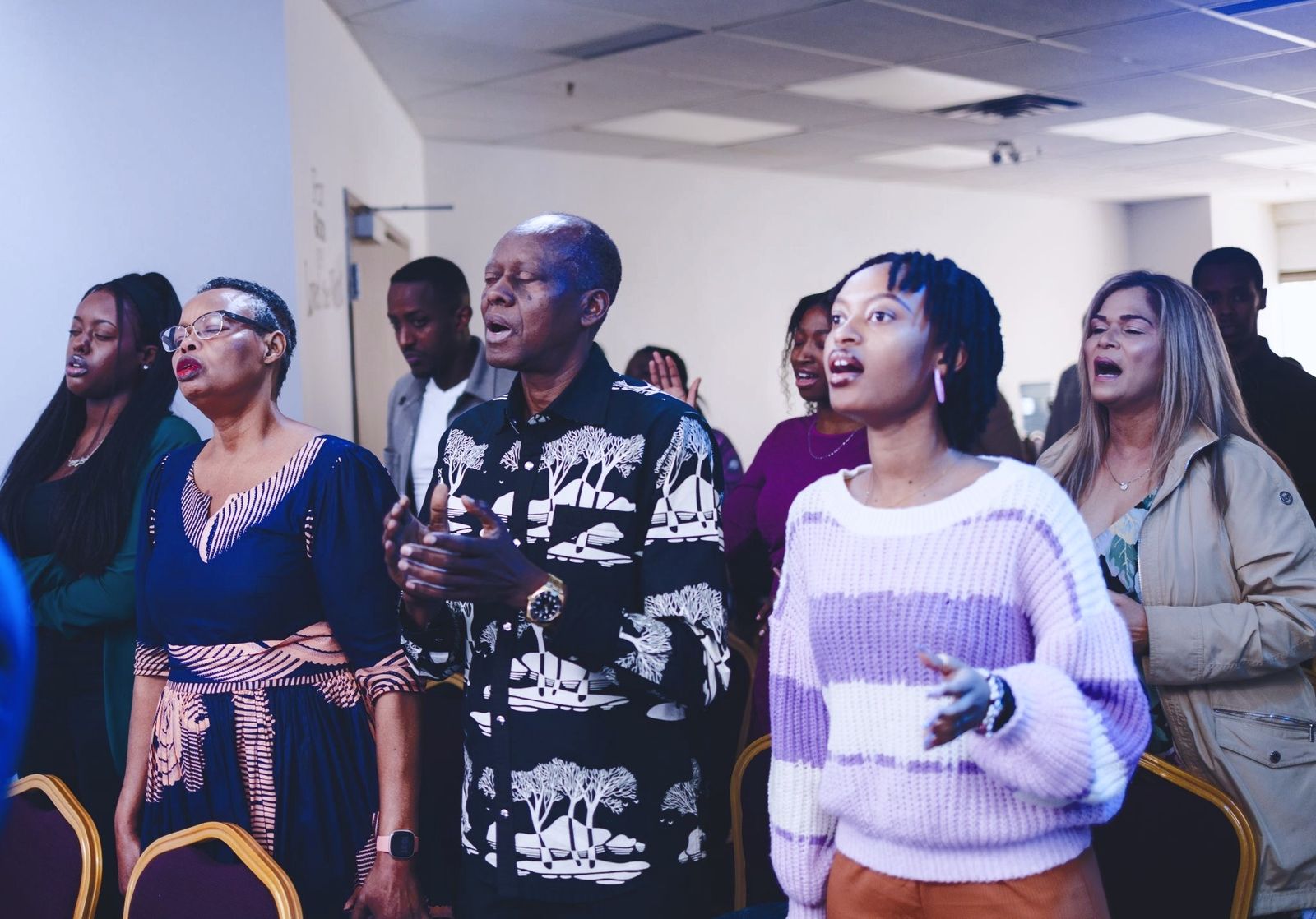 Congregation worshipping with hands raised